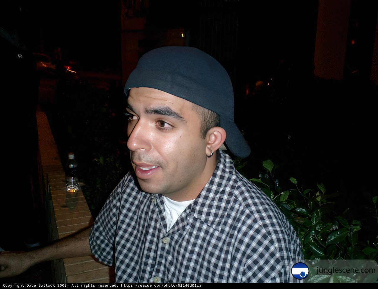 Urban Portraits: Man in Plaid Shirt and Hat