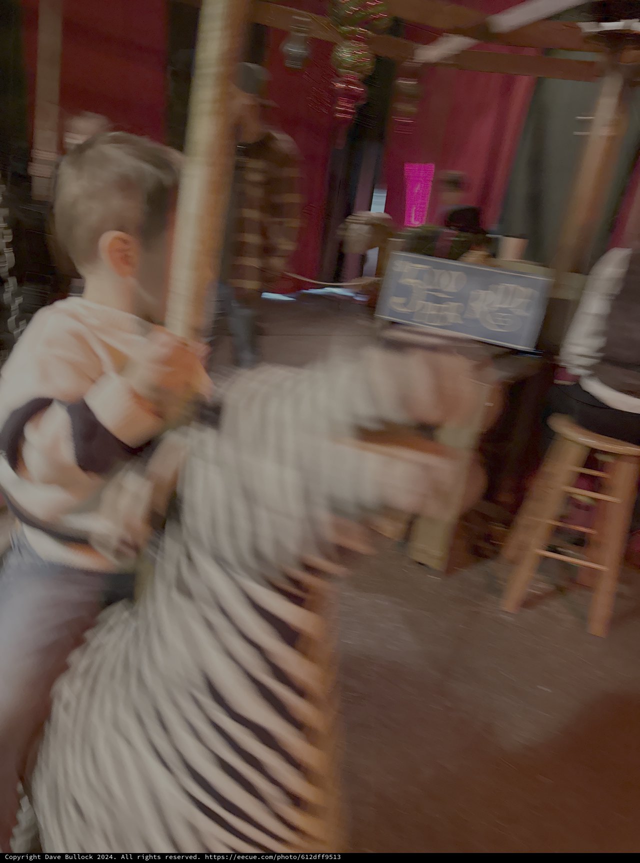 Motion Blur Child on Merry-Go-Round at Night