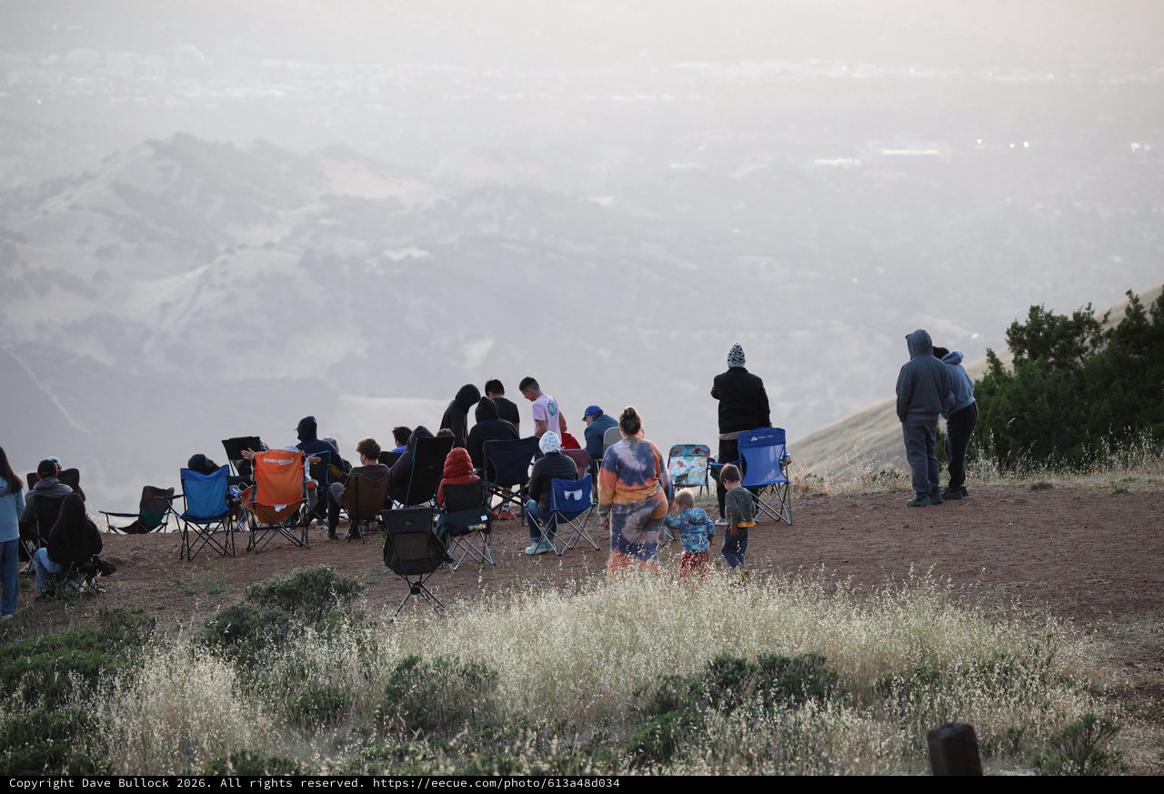 Mountain Viewpoint Gathering at Dusk Above the Valley