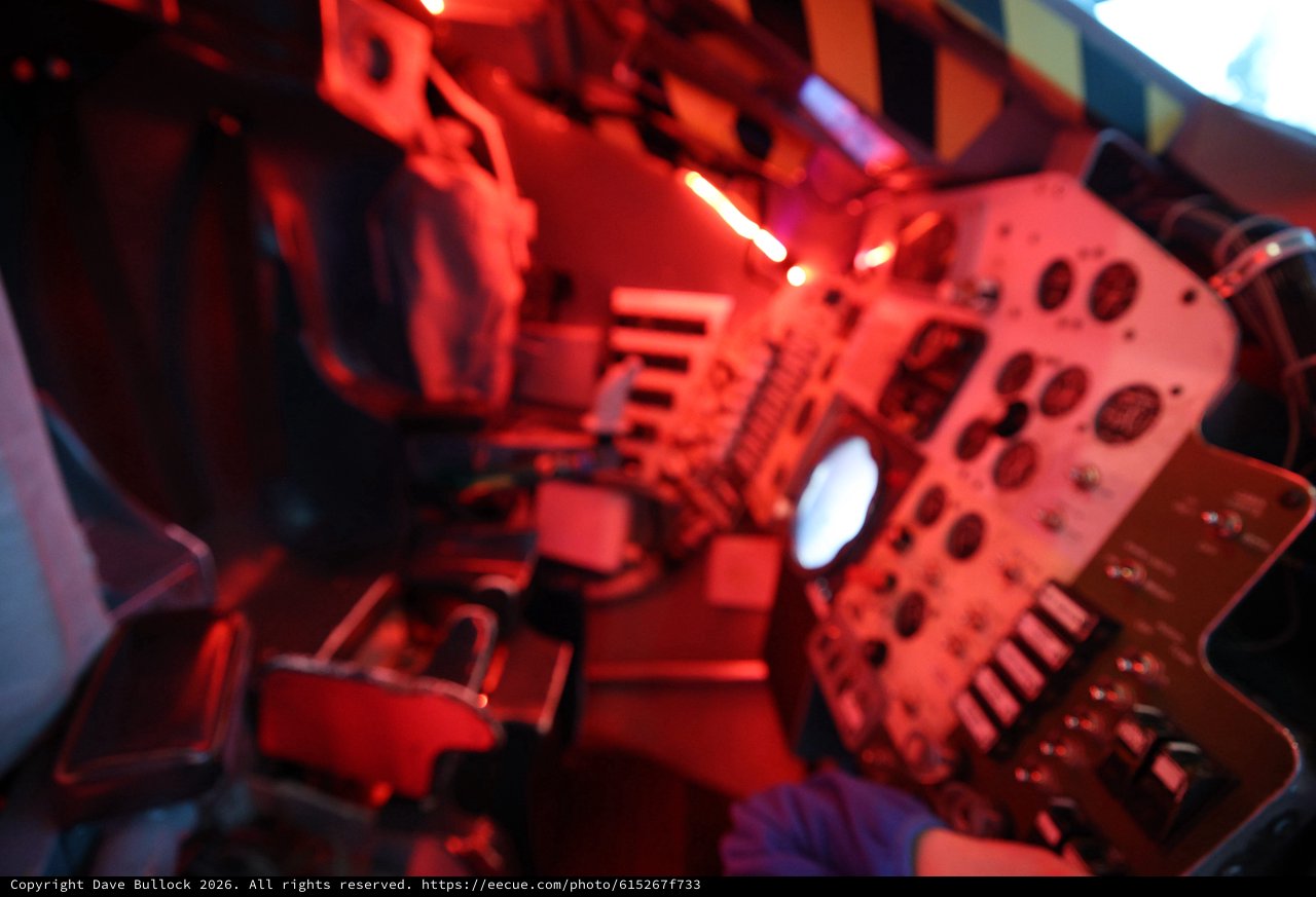Red-Lit Space Station Interior Display at Science Center