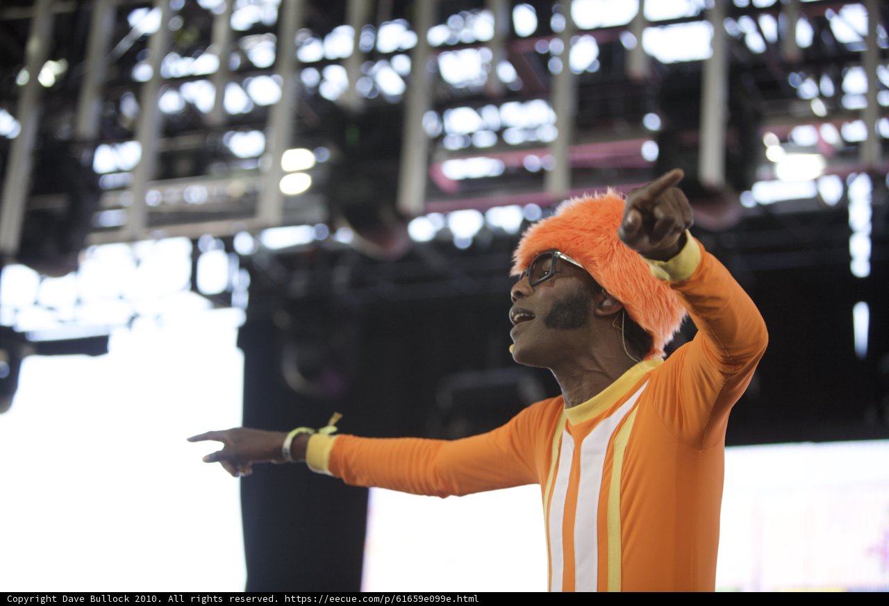 Orange Outfit Man Performs on Stage