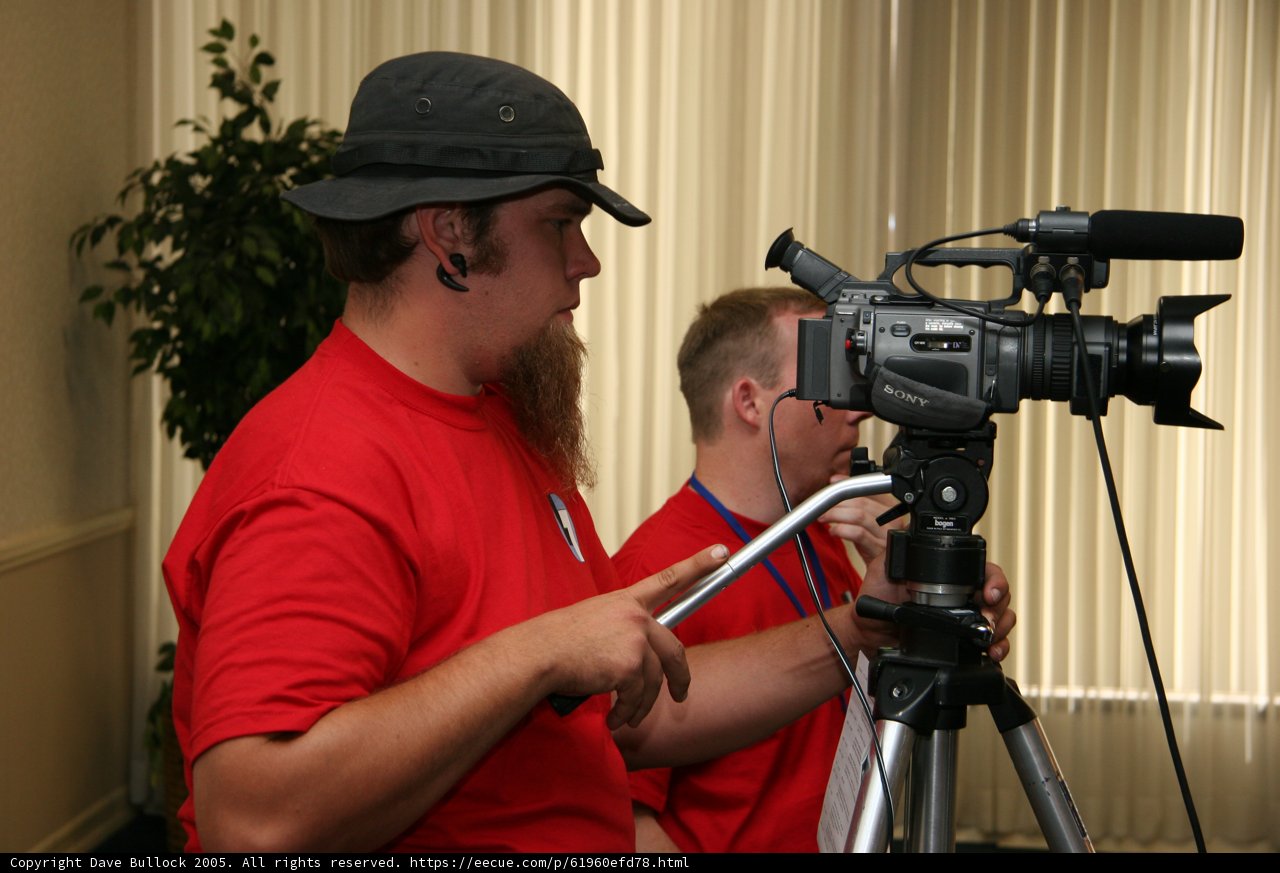 Red Shirted Photographer with Tripod