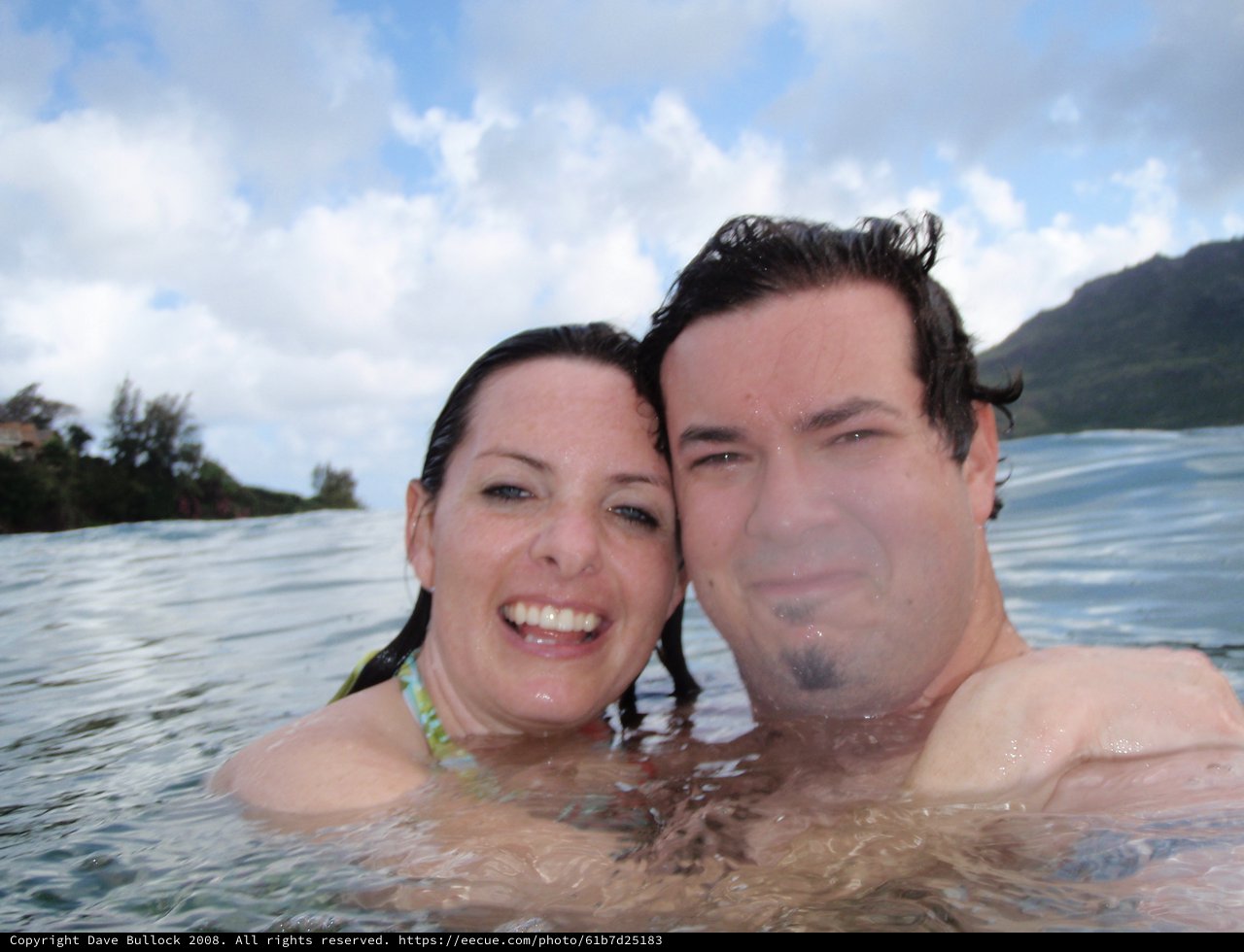 Couple Swimming in Hawaiian Ocean Waters Together