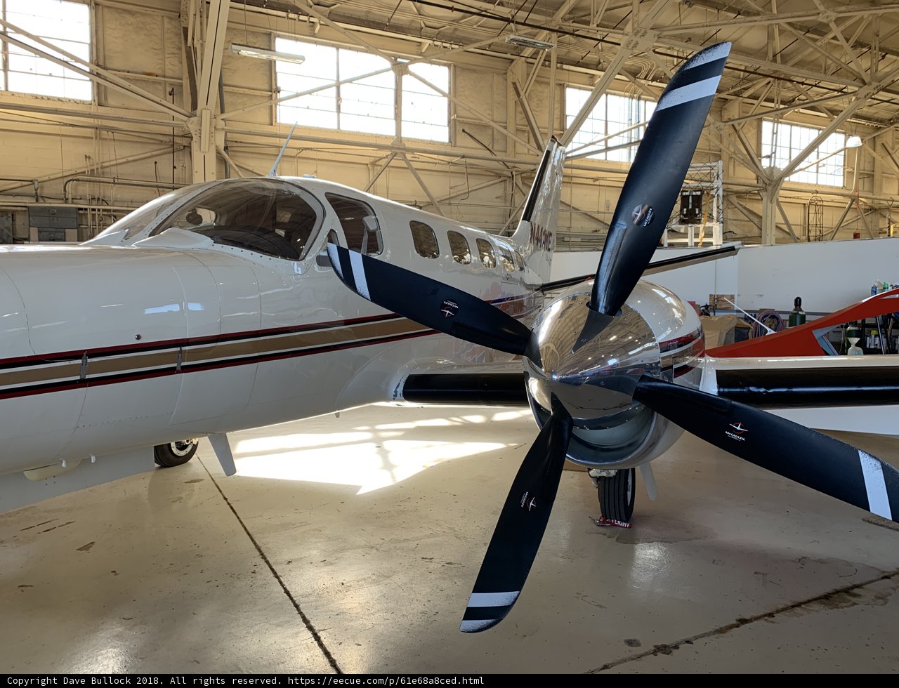 Parked Propeller Plane in Hangar