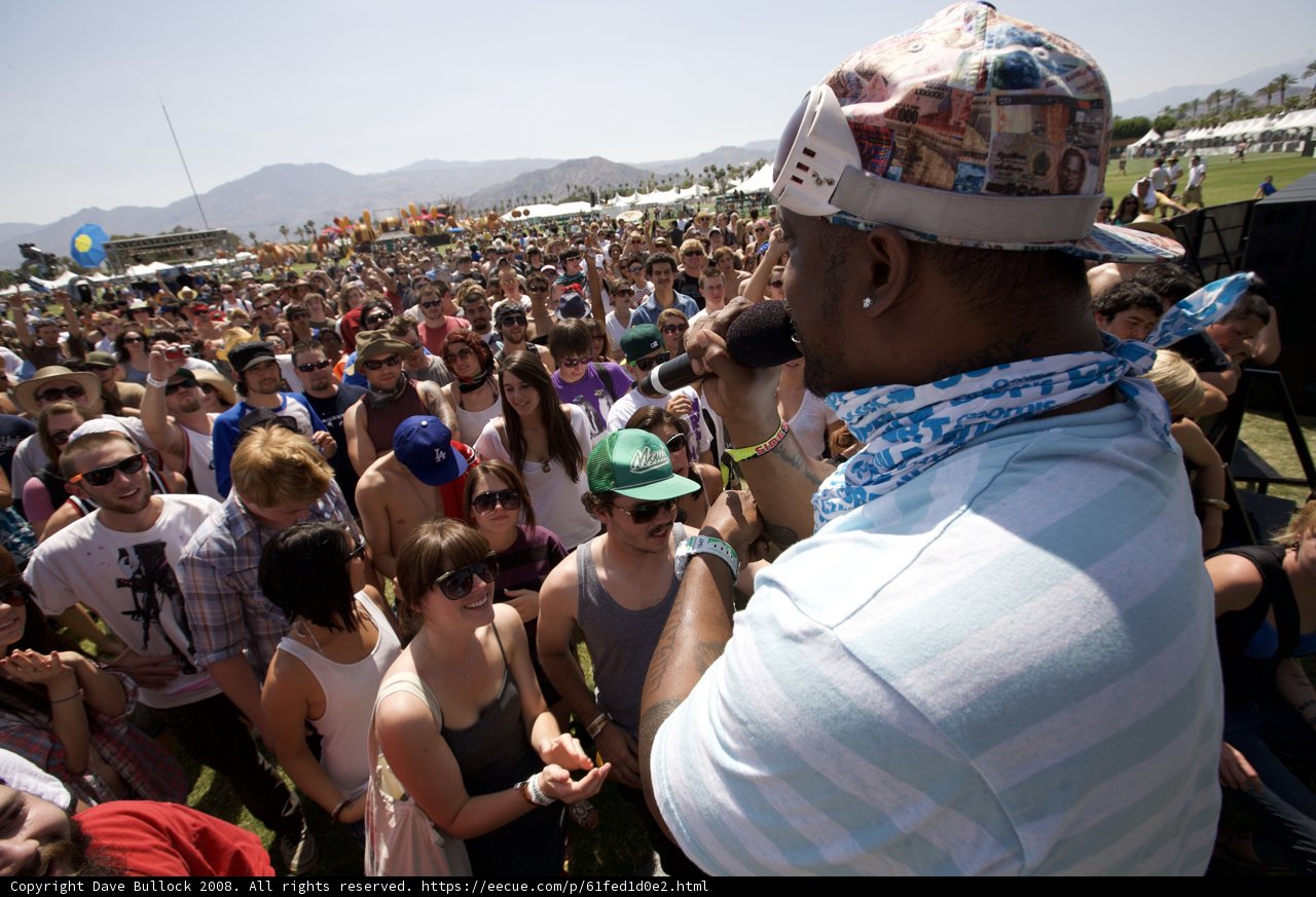 Man in Hat and Bandana Leads Coachella Crowd