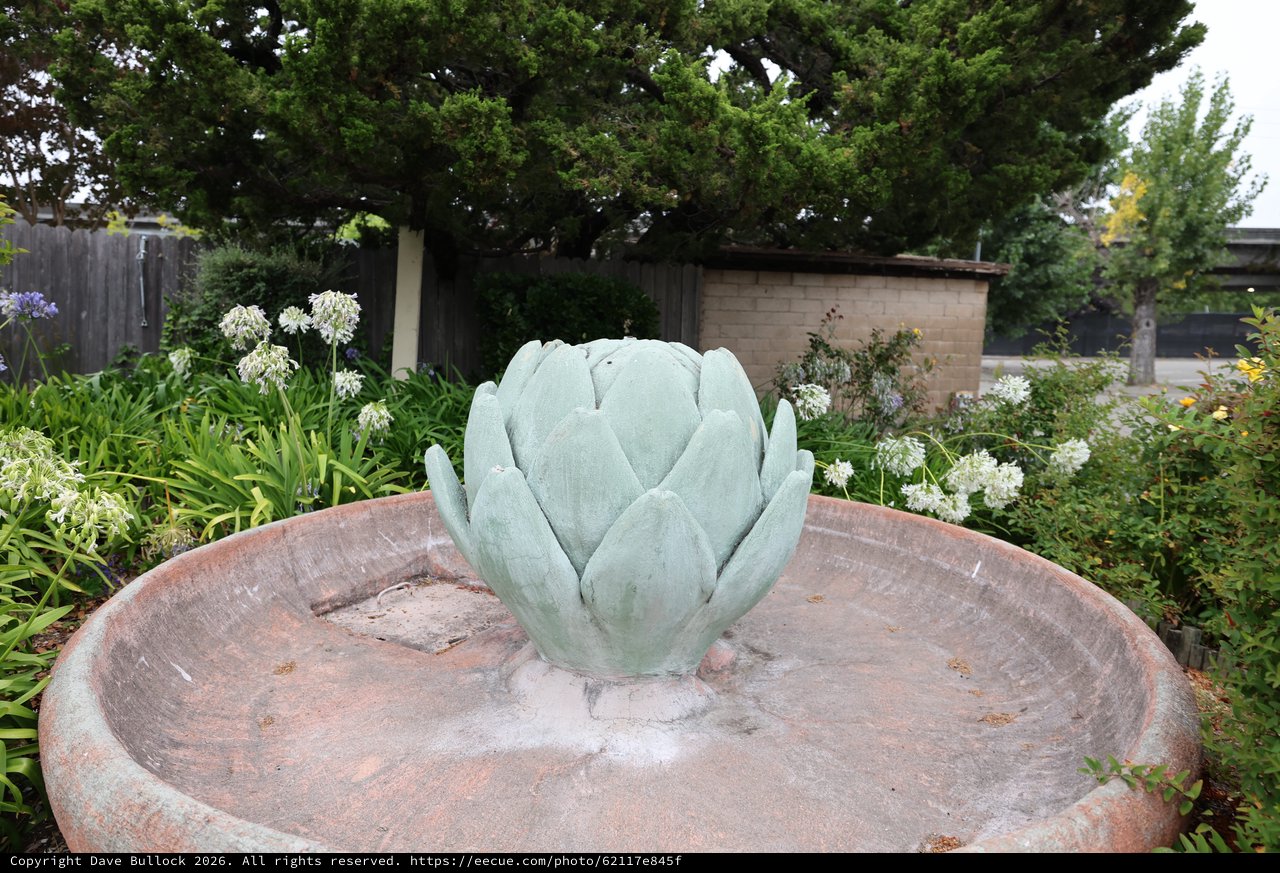 Artichoke Fountain Sculpture in Lush Garden Setting