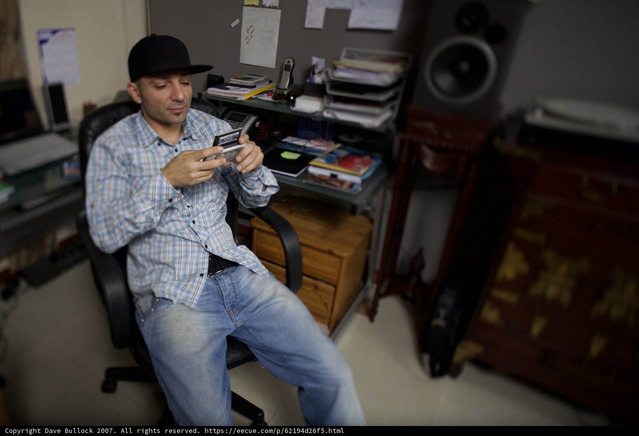 Hat-Topped Man Relaxing in His Living Room