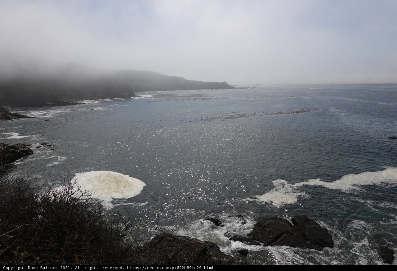 Majestic Promontory Overlooking the Hazy Ocean