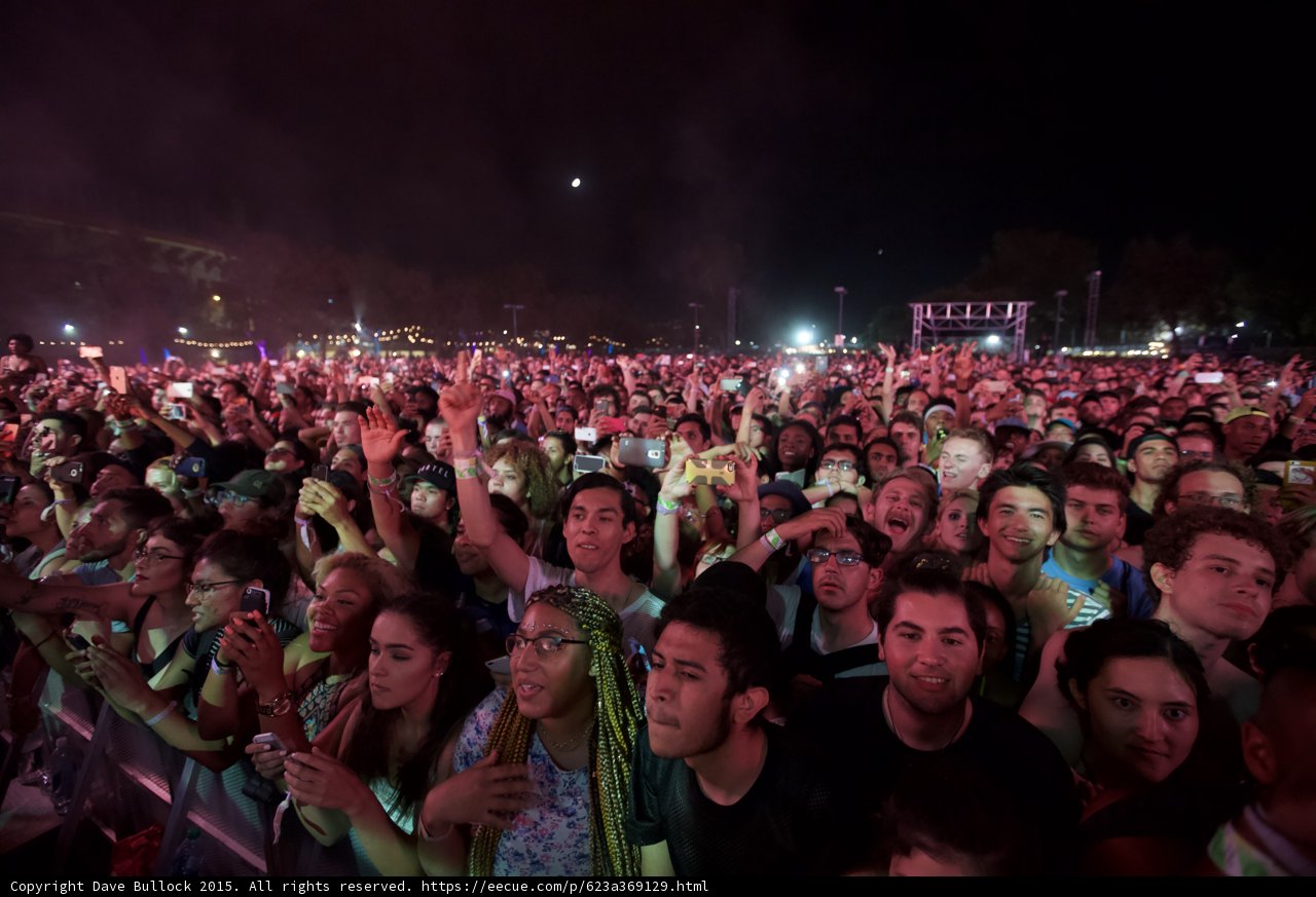 FYF Fest Sharp Crowd Woman Green Braids Glasses Floral Shirt Smiling Faces Moon Phones Stage Scaffolding