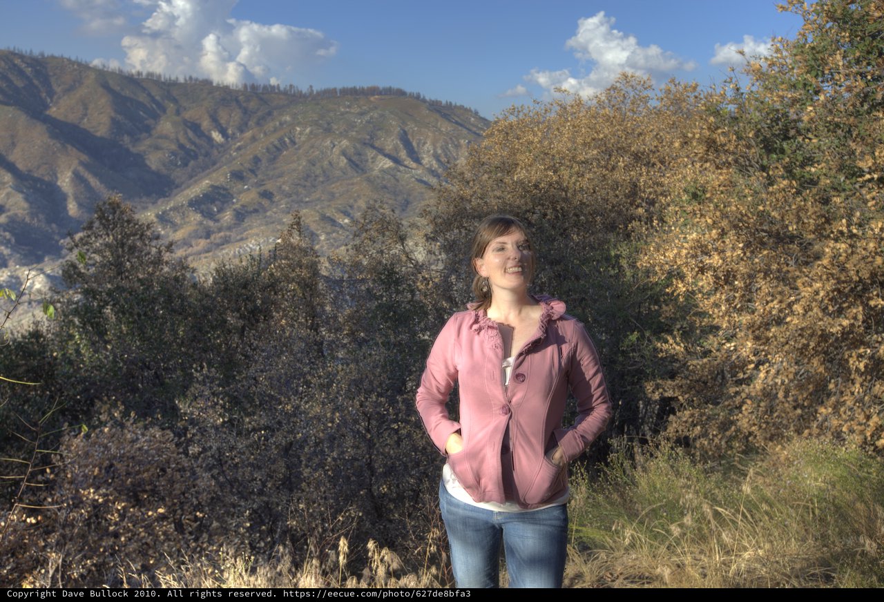 Woman Smiling Against Rugged California Mountain Backdrop