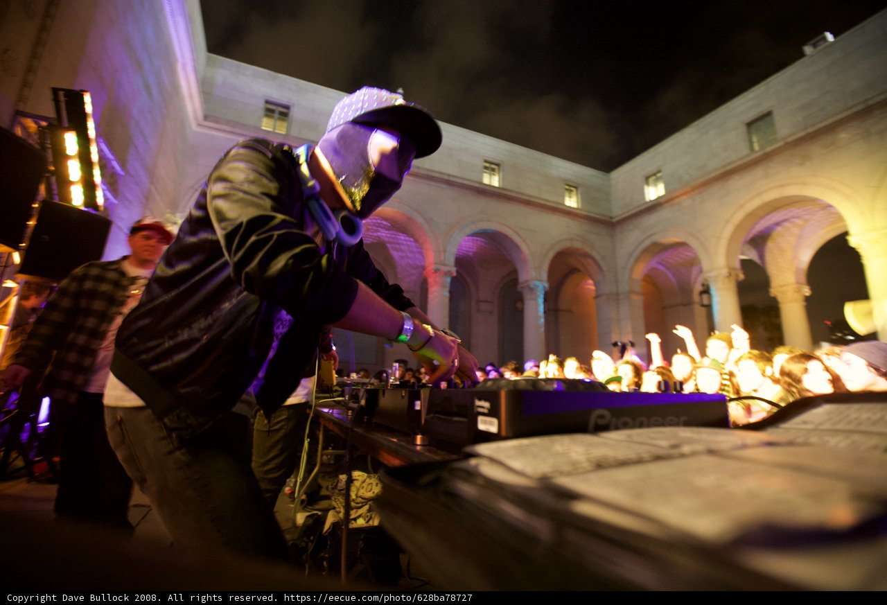 Masked Musician Serenades Crowd Under Night Sky