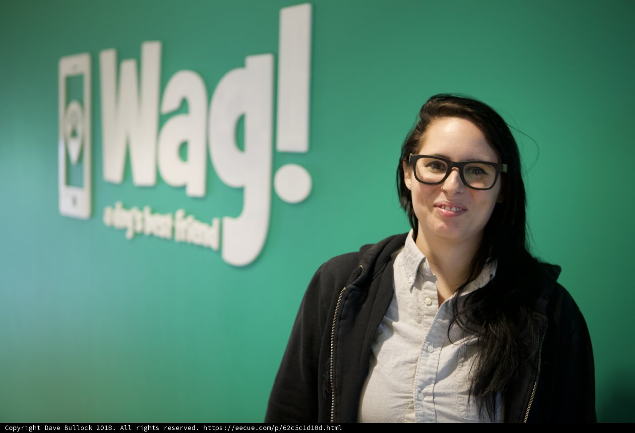 Stylish Woman Poses with Iconic Wag Logo