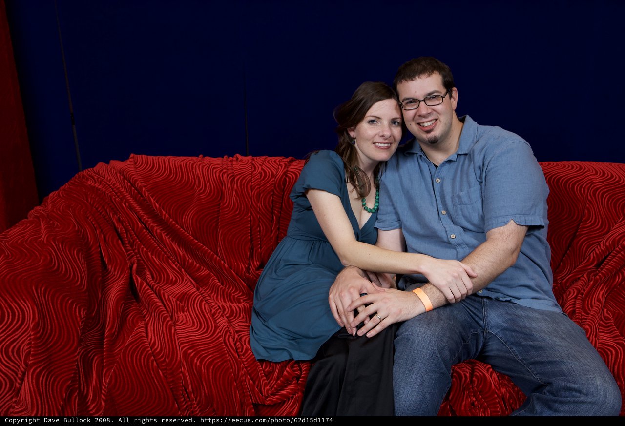 Couple Poses Together at Holiday Party Portrait