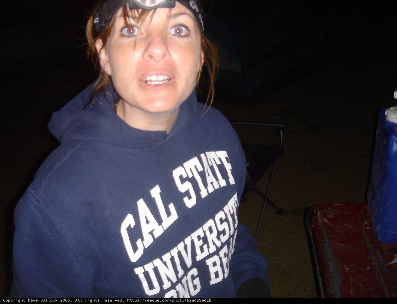 Startled Woman at Night Outdoor Gathering