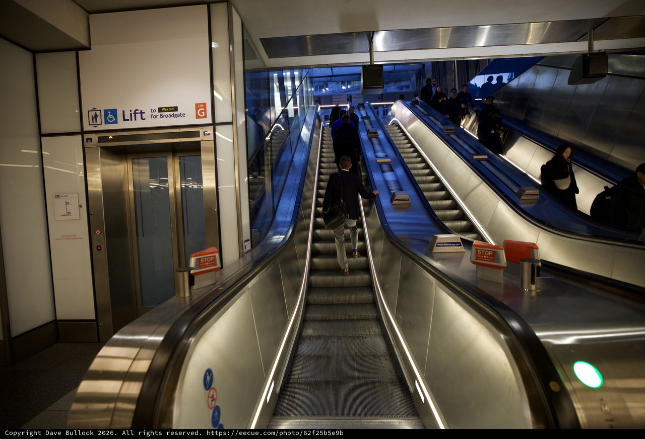 Modern Underground Transit Station with Blue Escalators