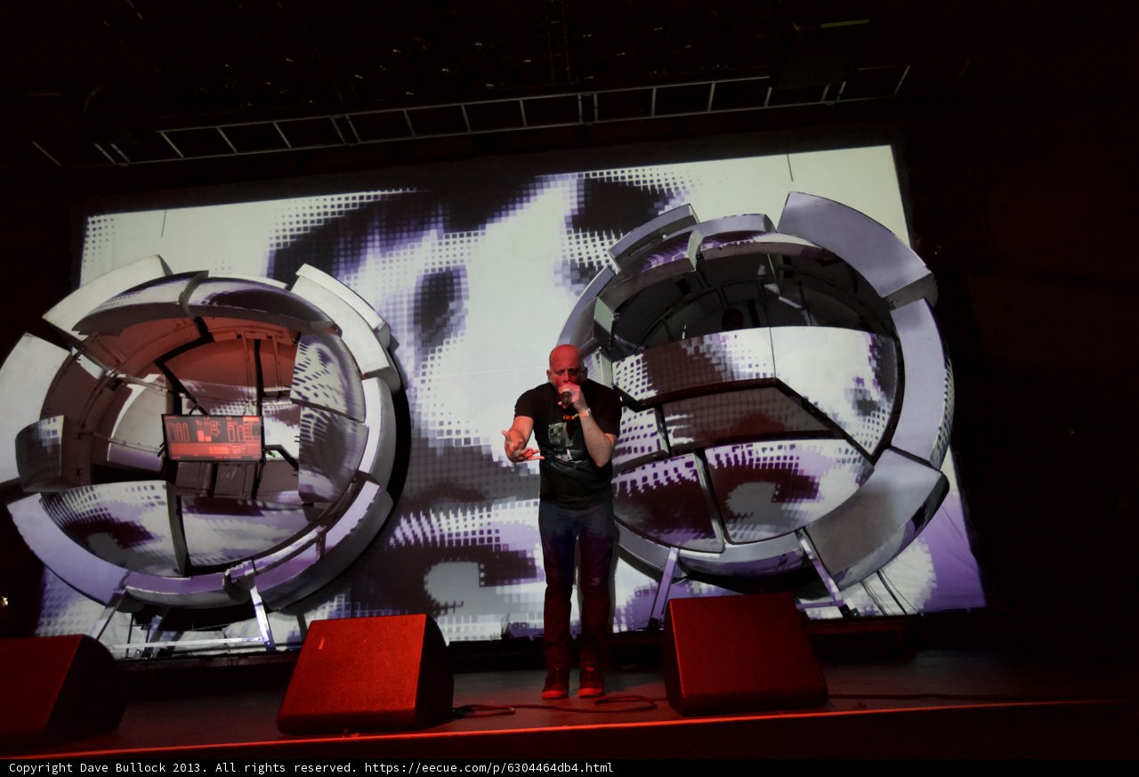 Man on Stage with Impressive Screen