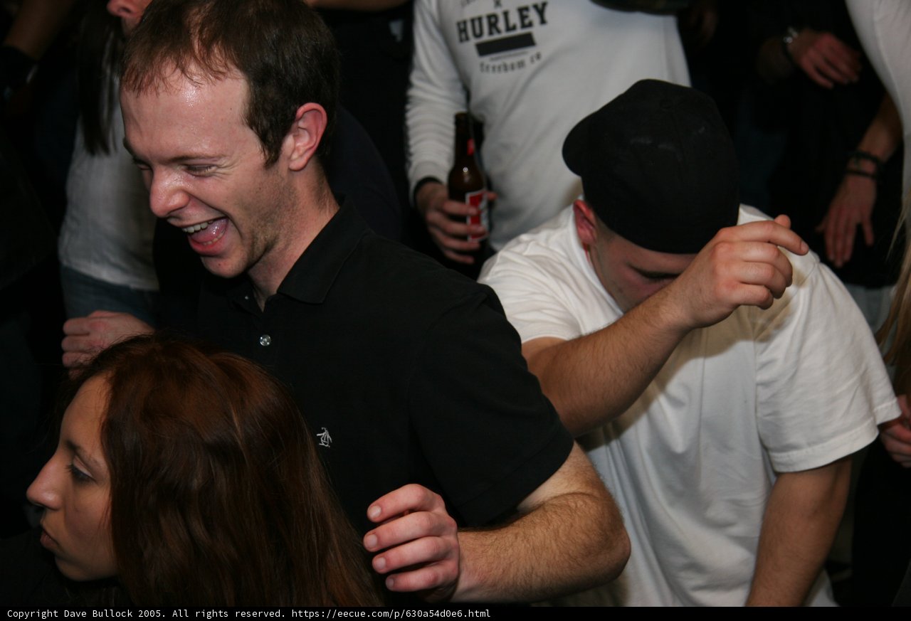 Black Shirted Man in Urban Bar