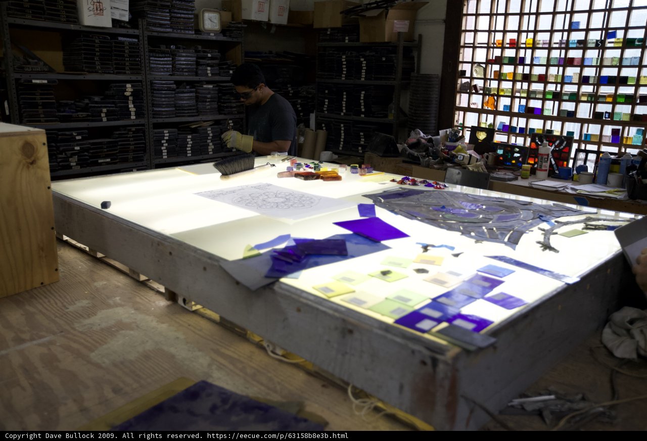 Working on a Plywood Table in a Factory Workshop