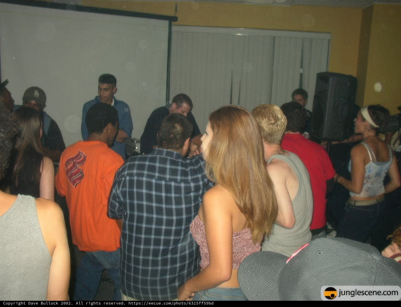 Speaker Engages Crowd at Night Club