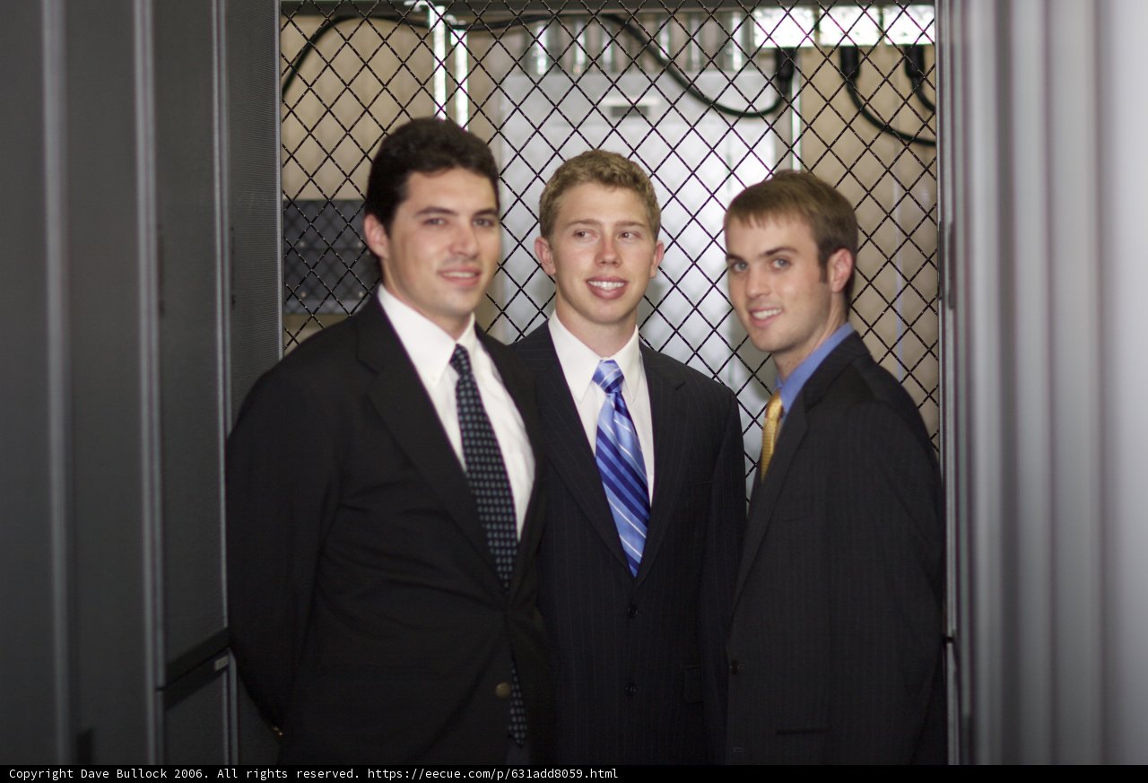 Three Men in Suits Strike a Pose