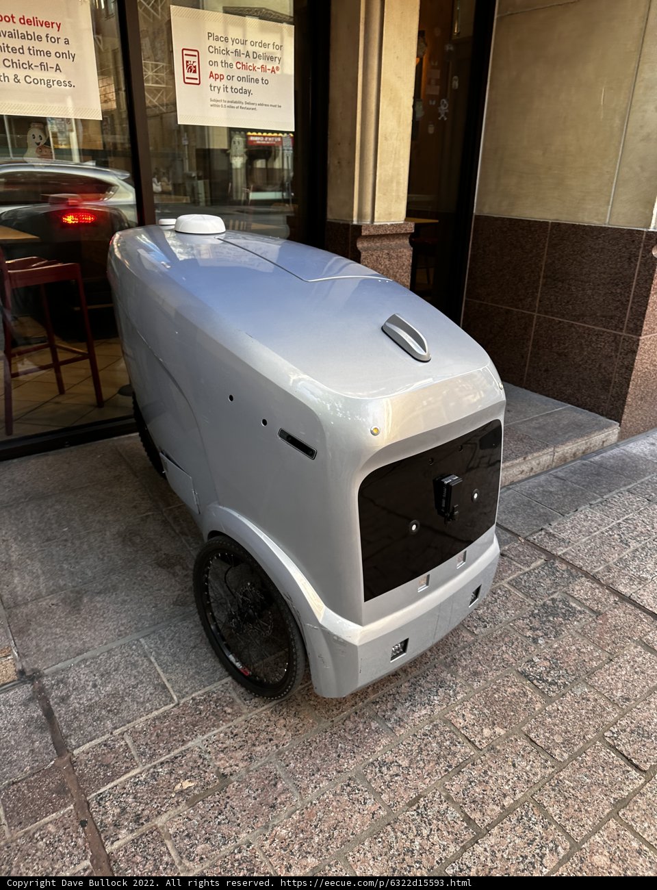 Small Silver Vehicle Parked on Austin Sidewalk