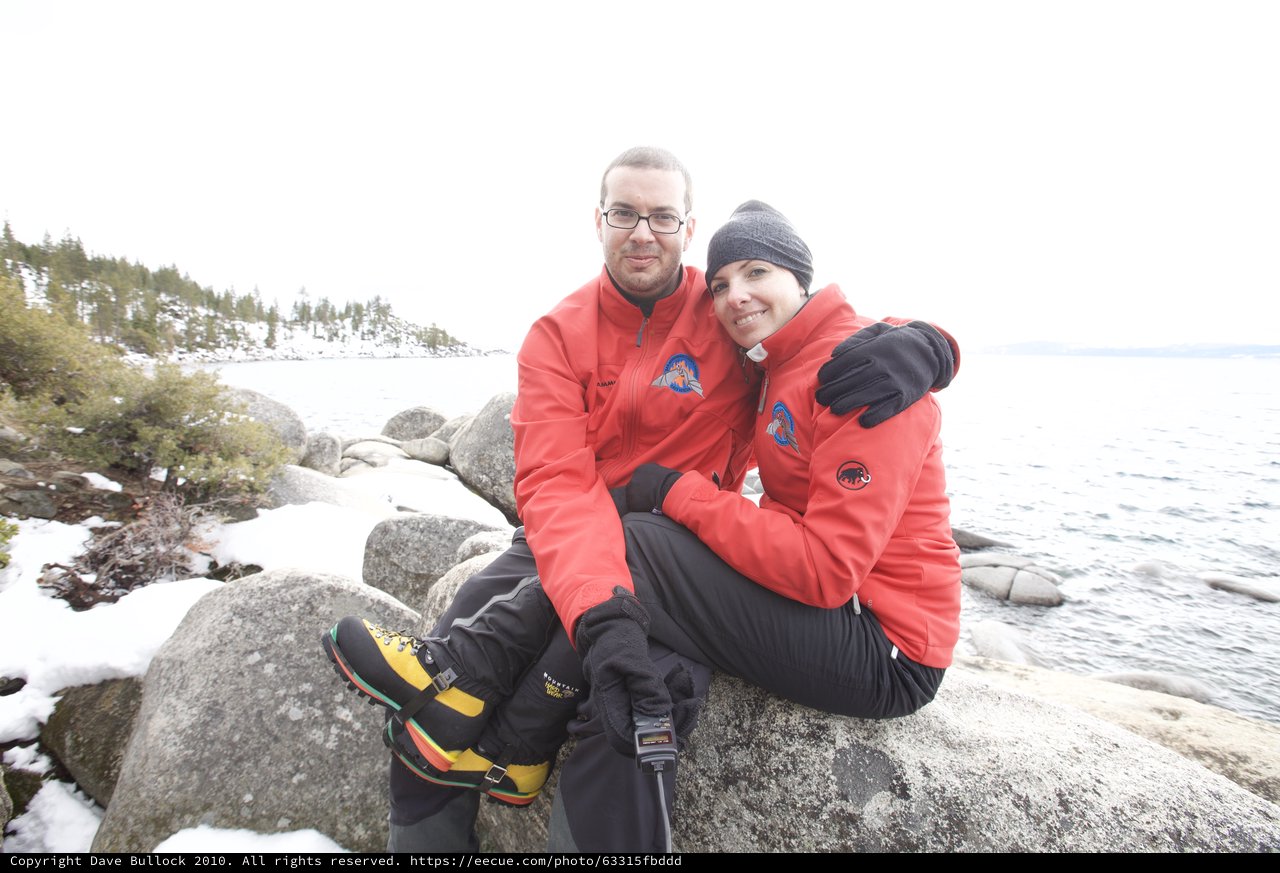 Couple Embracing at Snowy Lake Tahoe Shore