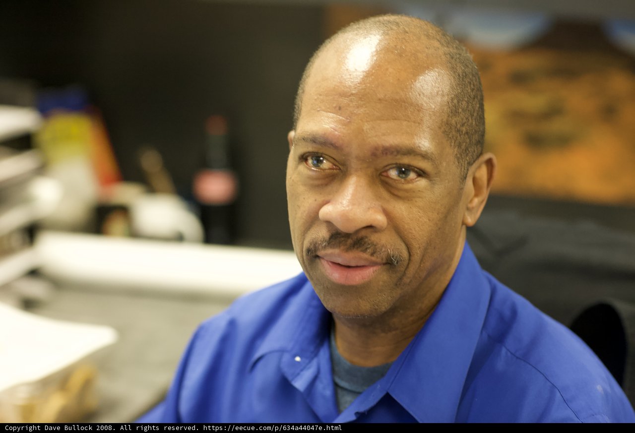 Blue-Shirted Man Smiling for the Camera