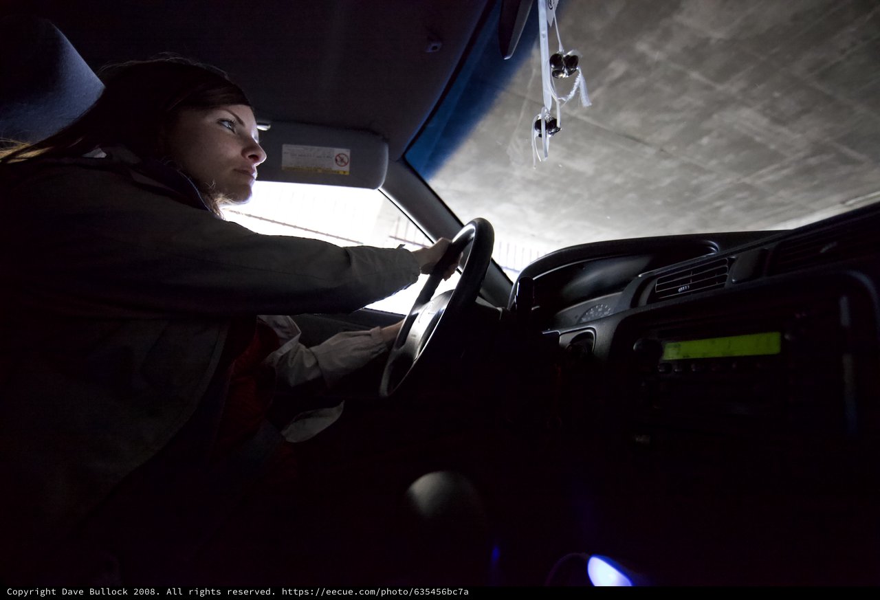 Night Drive: Woman at the Wheel in Darkness