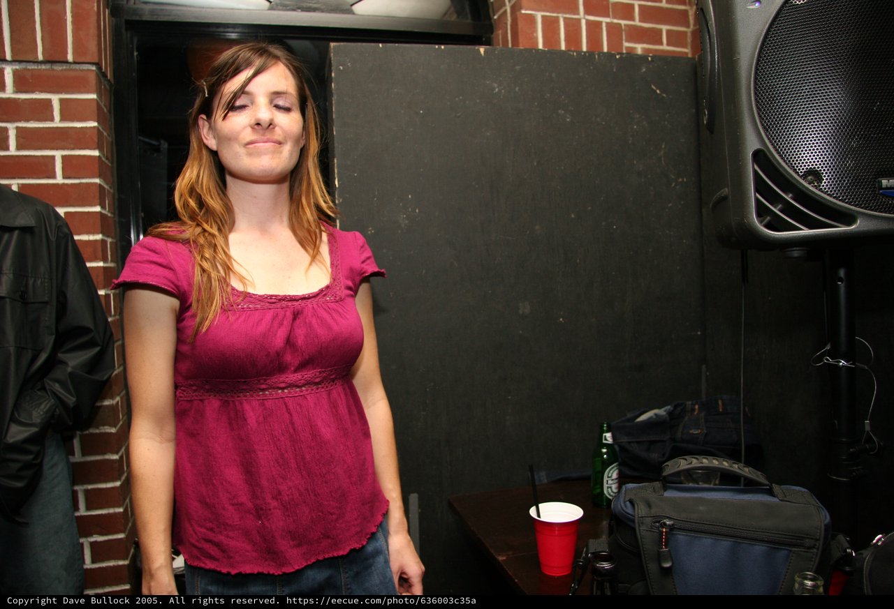 Woman with Eyes Closed at Live Music Venue
