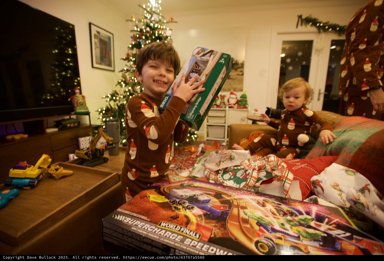 Excited Boy with Christmas Presents on Holiday Morning