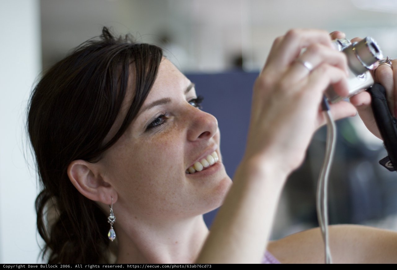 Joyful Woman Captures a Moment with Camera