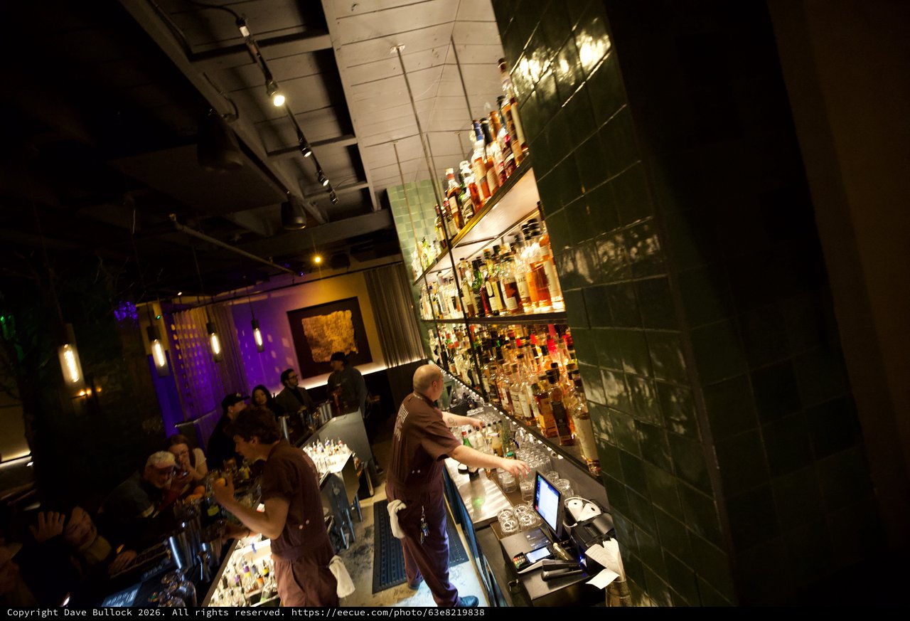 Upscale Bar Interior with Green Tile and Purple Ambiance