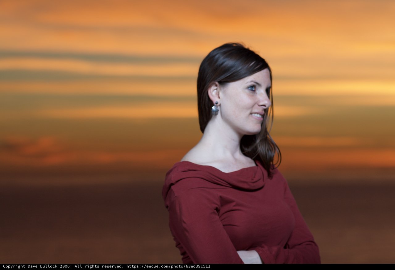 Woman Gazing Into a Fiery Sunset Sky