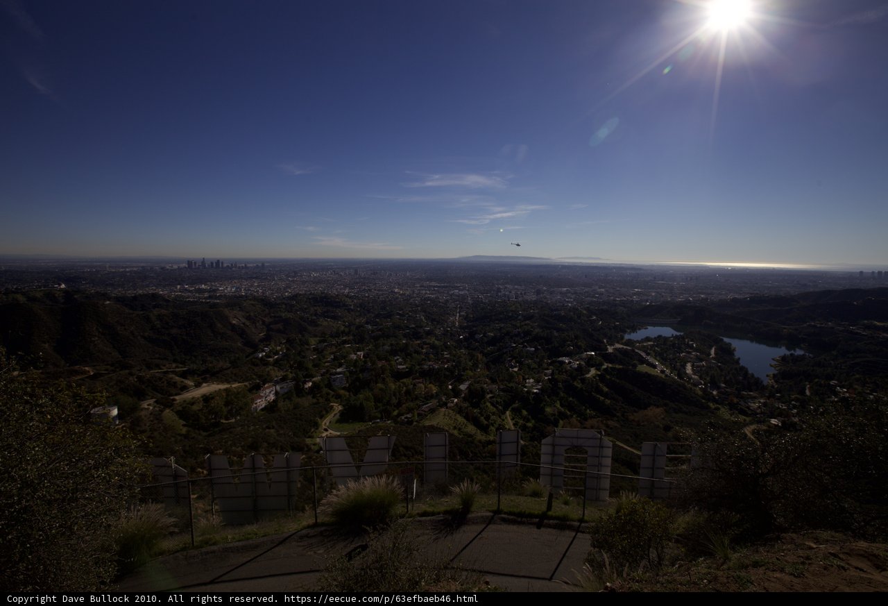 Shining Sun Over City and Hills