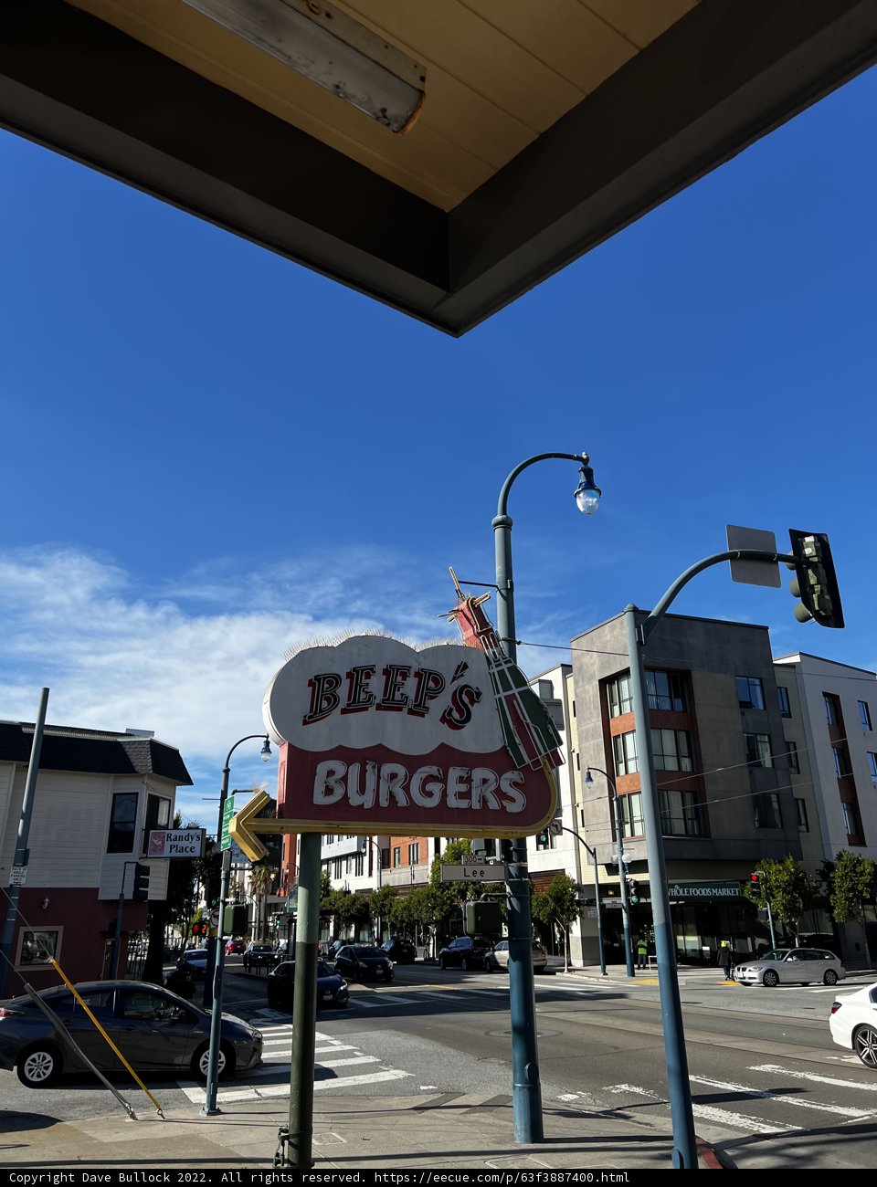 Burger Joint Sign in City Street Intersection