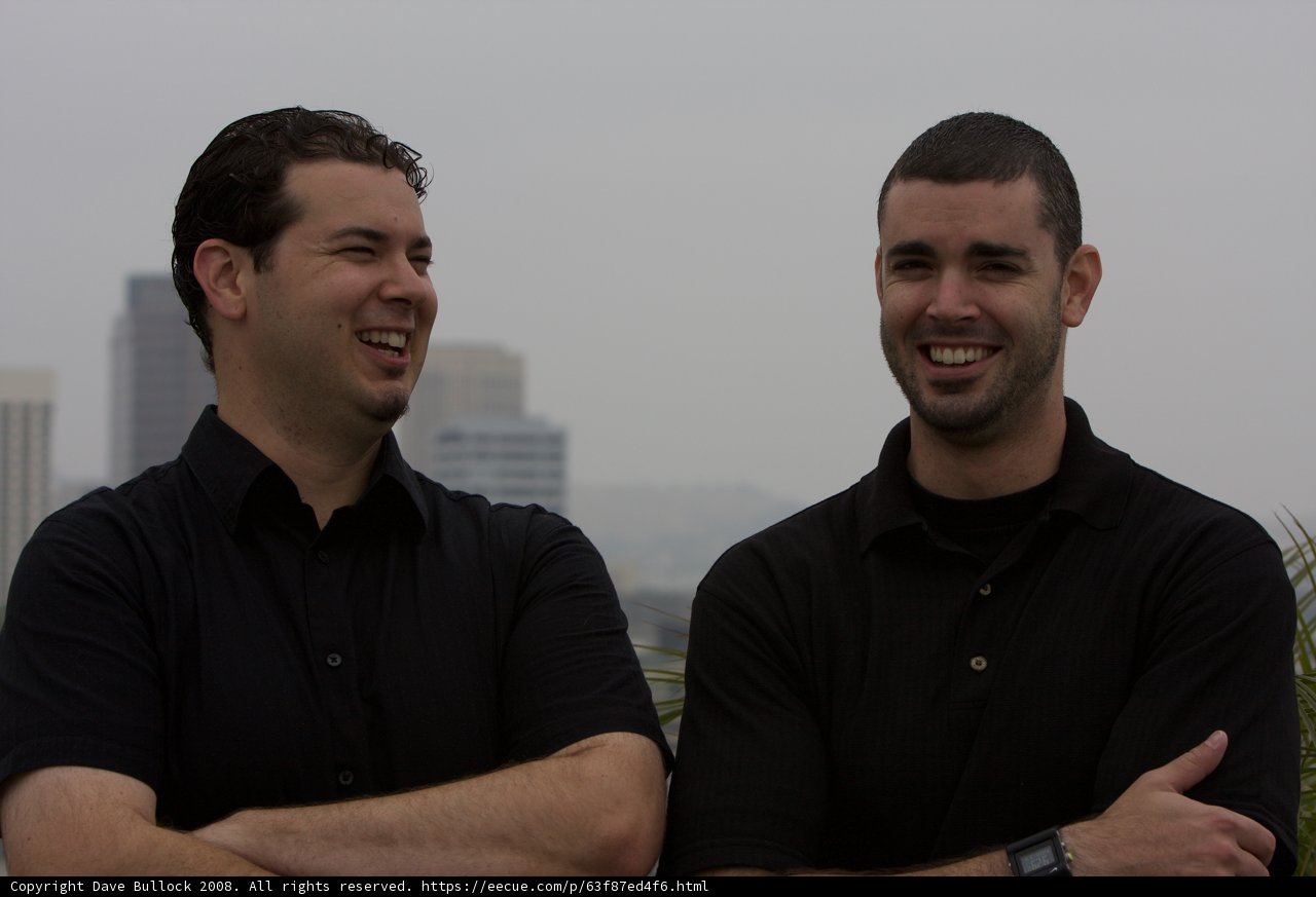 Two Happy Men in Black Shirts