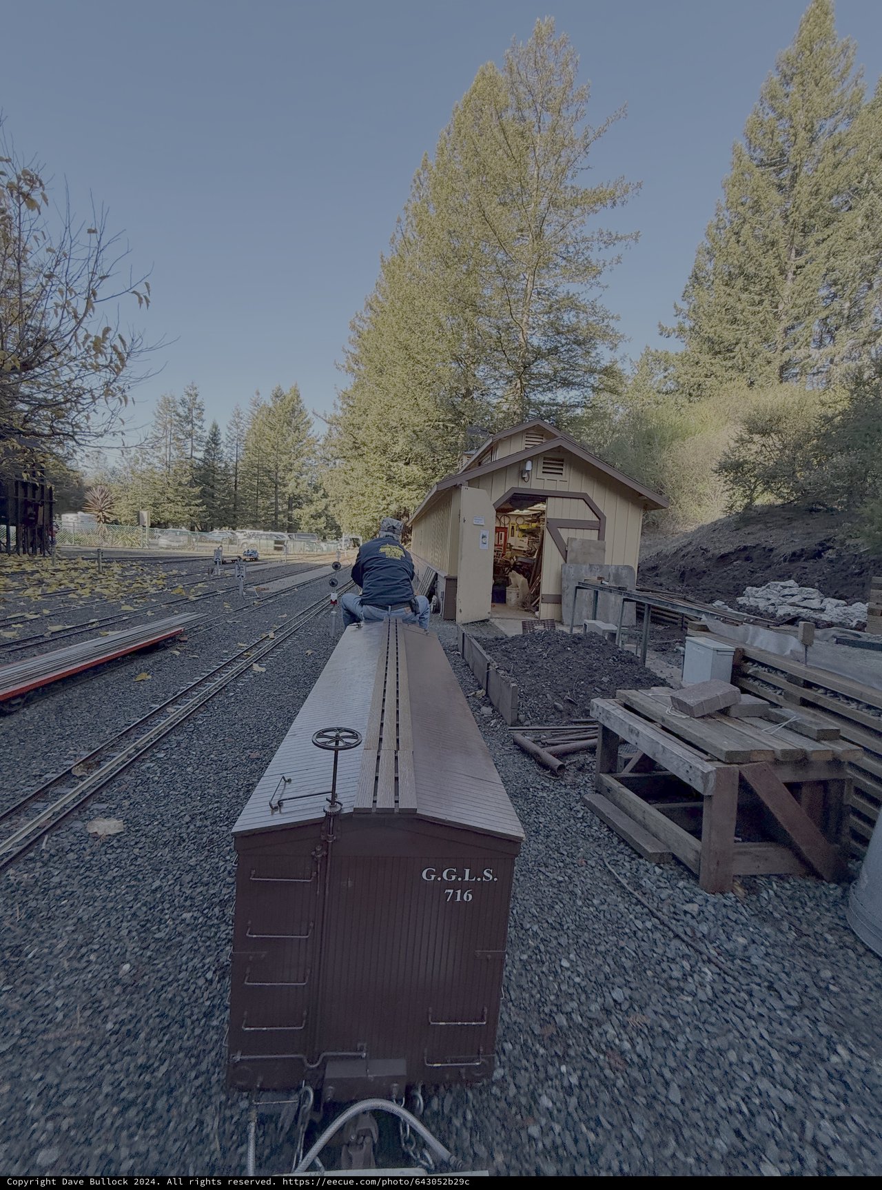 Historic Railway Maintenance Scene with Vintage Boxcar