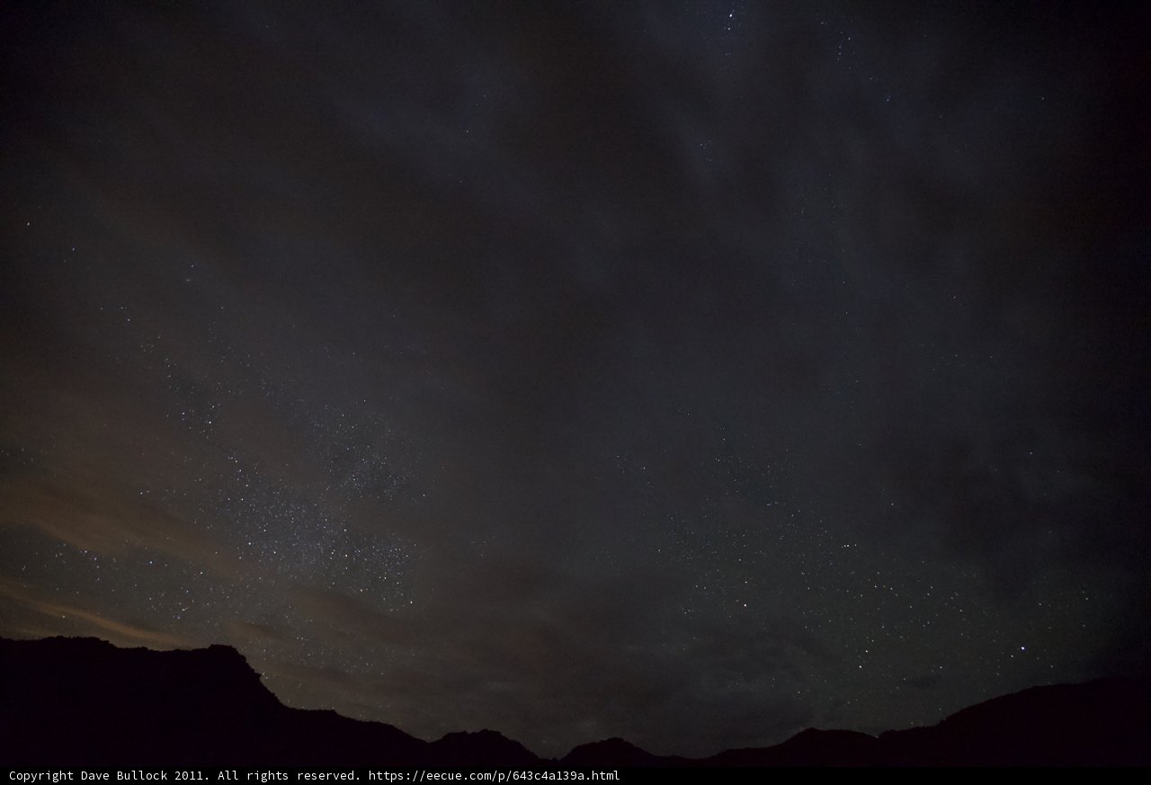 Night Sky Filled with Stars and Clouds