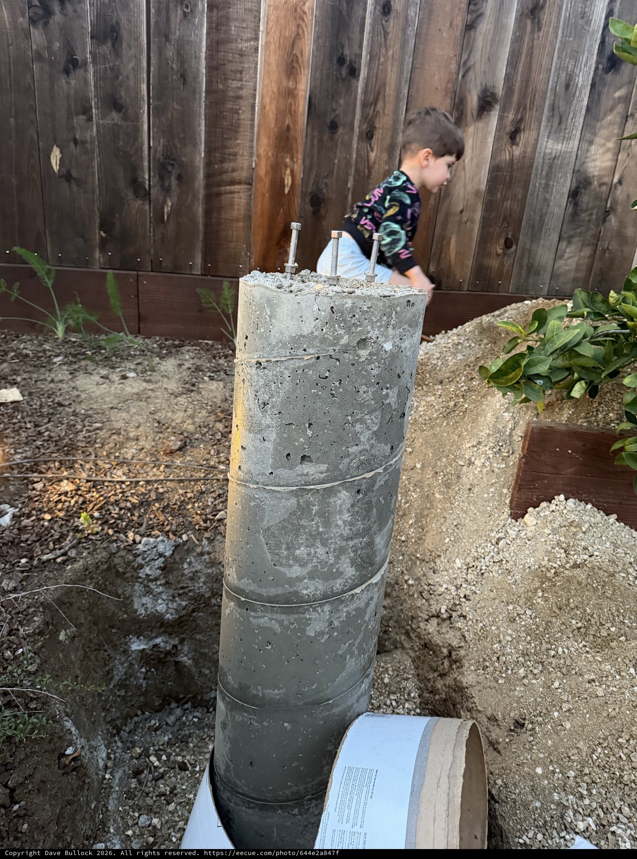 Concrete Pier Footing with Anchor Bolts in Backyard
