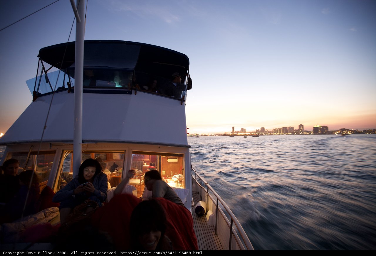 Boat ride at sunset with cityscape