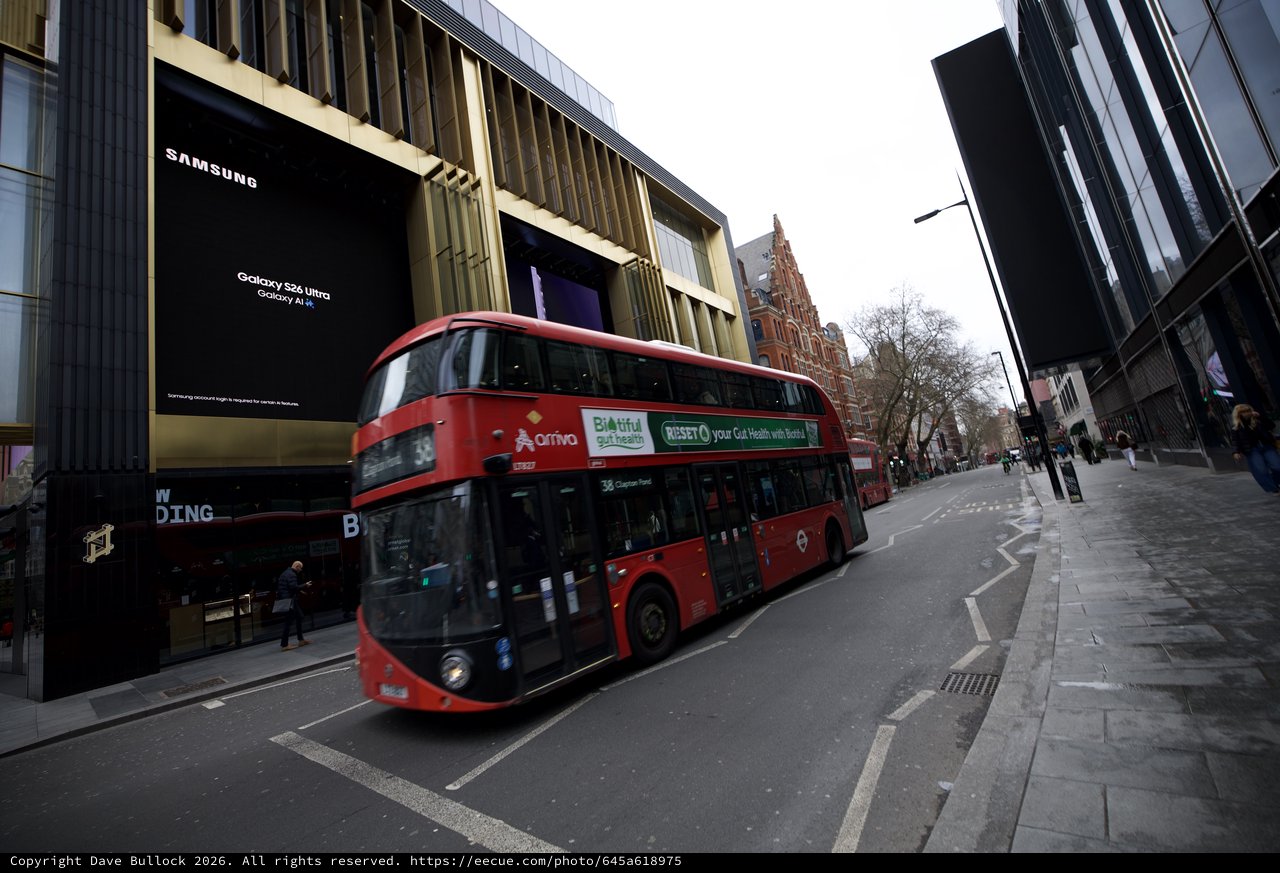 Red Double-Decker Bus on Modern London Street