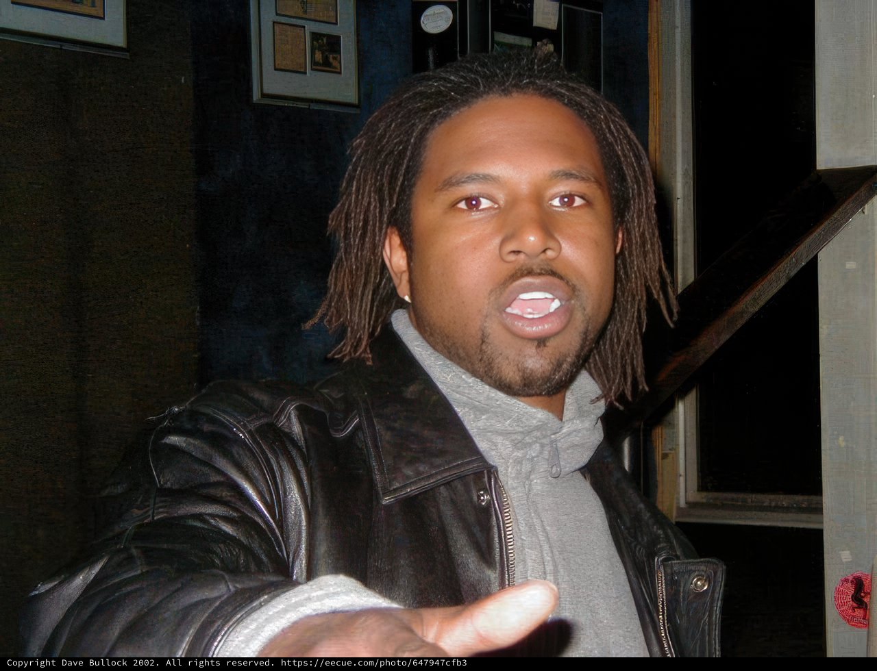Dreadlocked Man in Artful Jacket