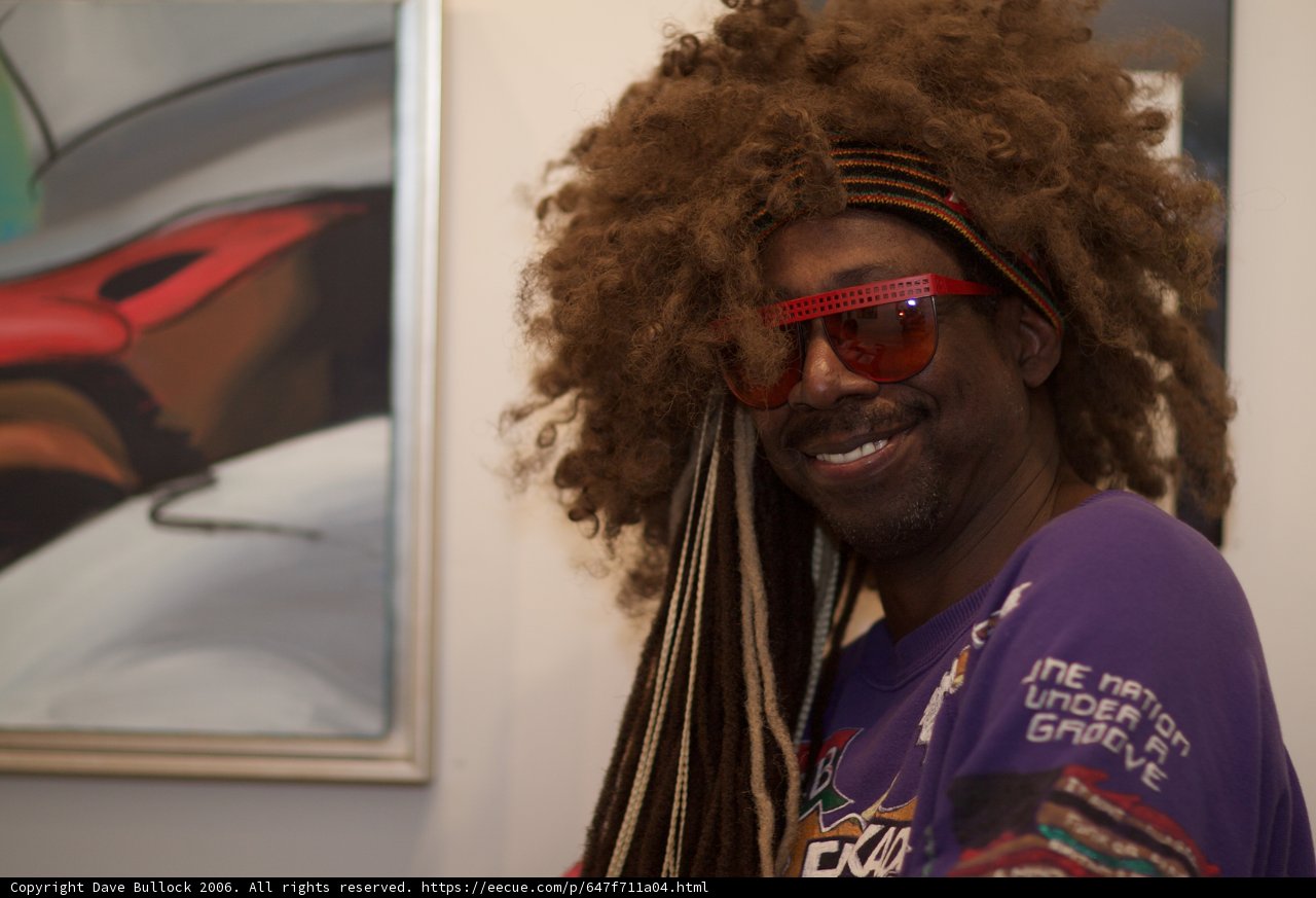 Portrait of a Sunglasses-Wearing Man with Dreadlocks