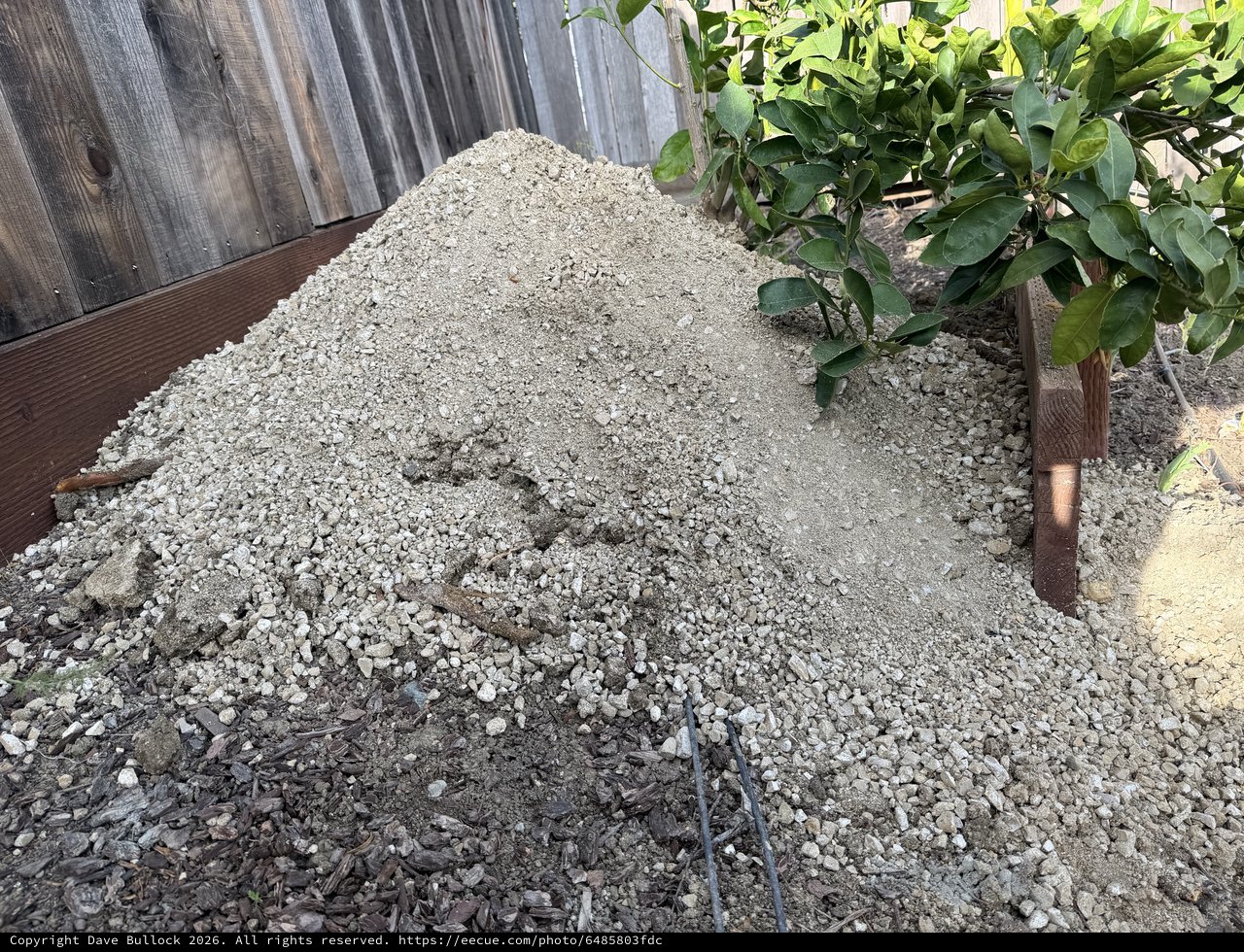 Fresh Gravel Pile in Residential Backyard Construction