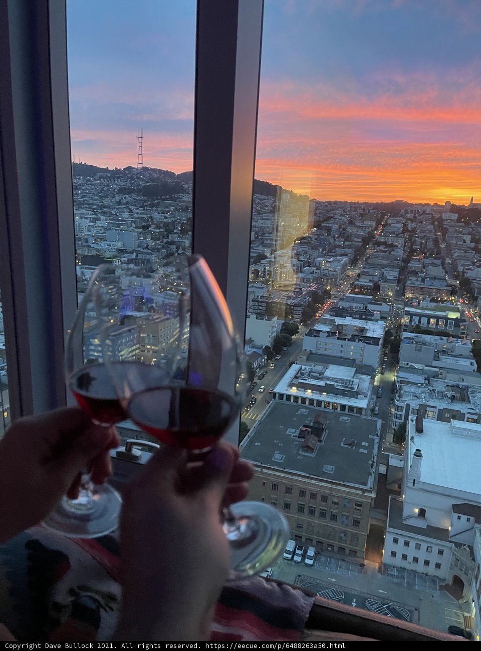 Sipping Red Wine Above the Urban Metropolis