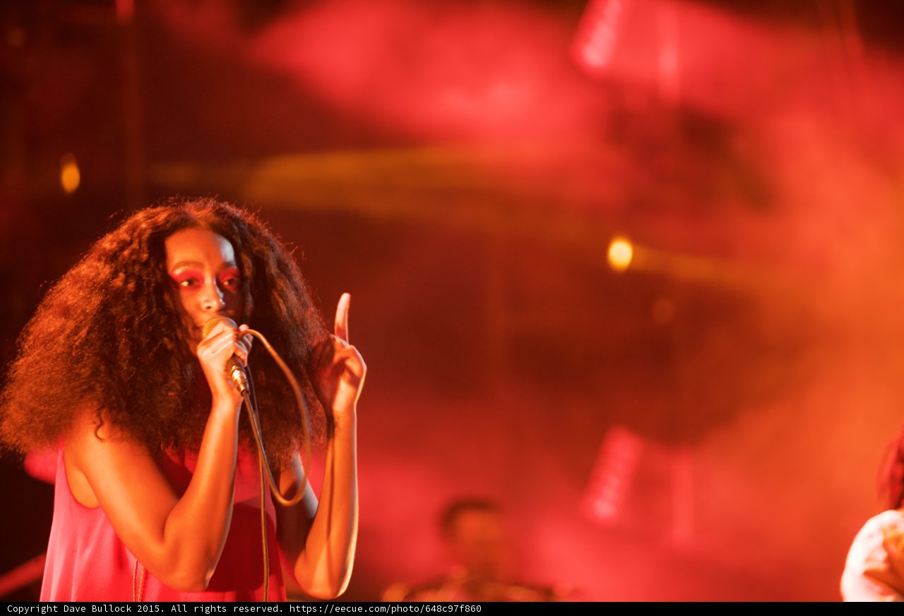 Solange Portrait Singing Finger Pointing Up Red Pink Haze