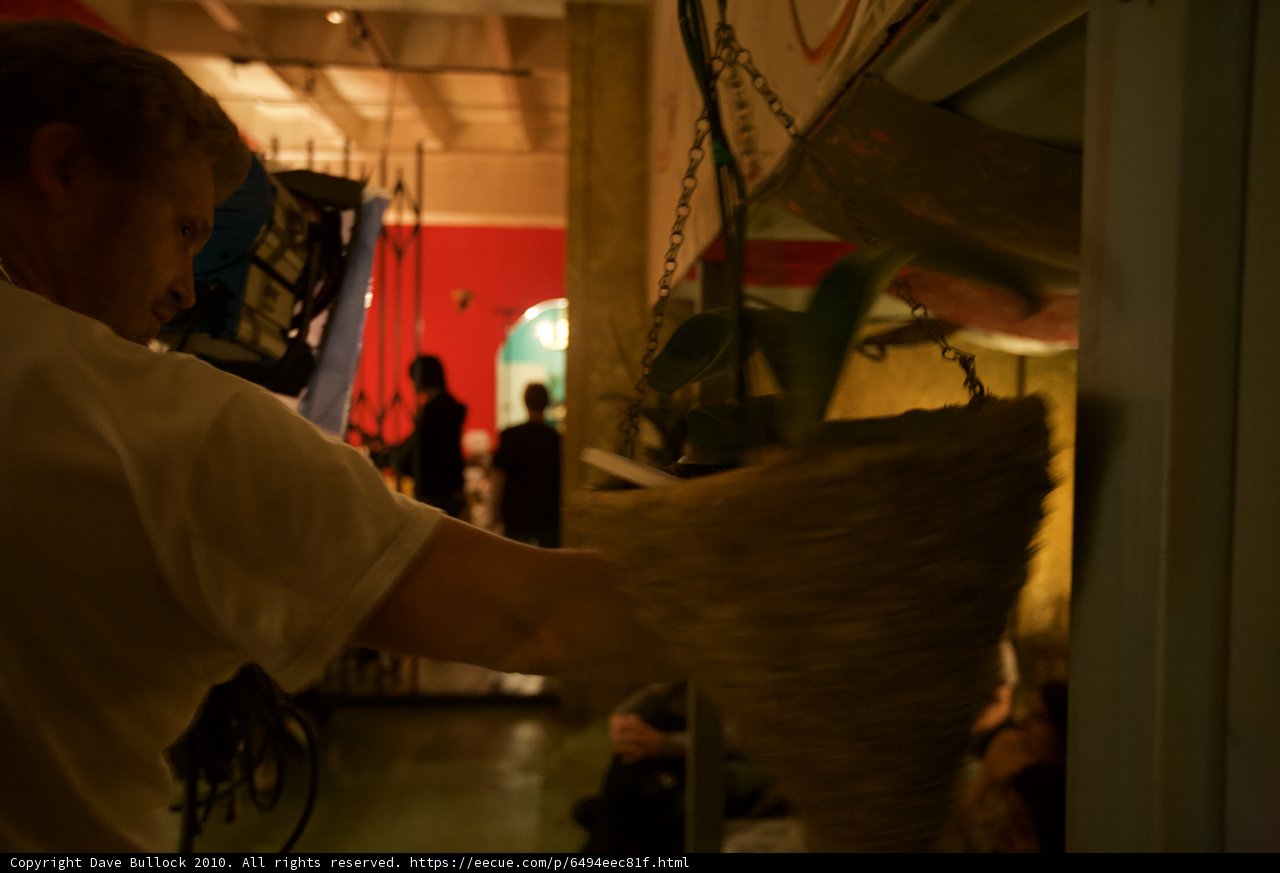 Man holding a plant in an industrial setting