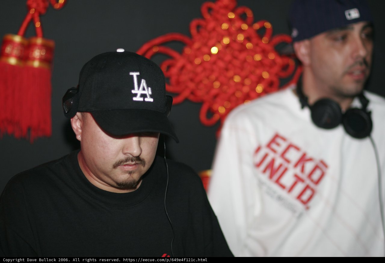 Two Men Rocking Their Baseball Caps and Headphones