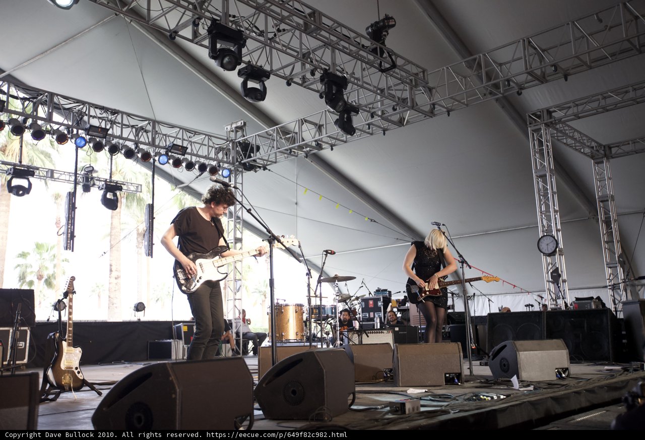 Band rocking the Coachella stage in a tent
