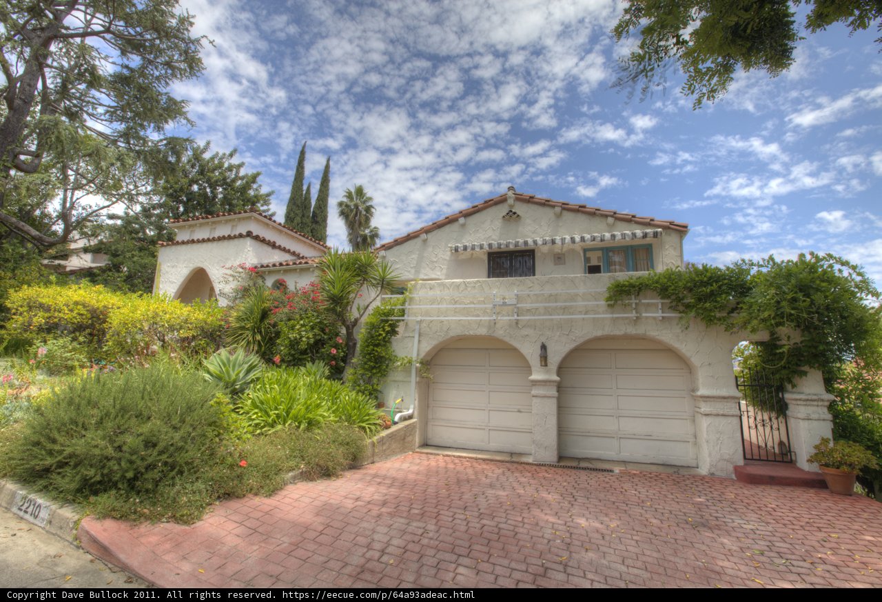 Serene Villa with Flagstone Walkway and Lush Landscaping
